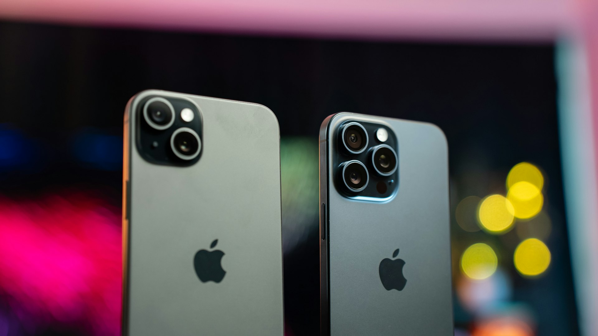two iphones side by side on a table